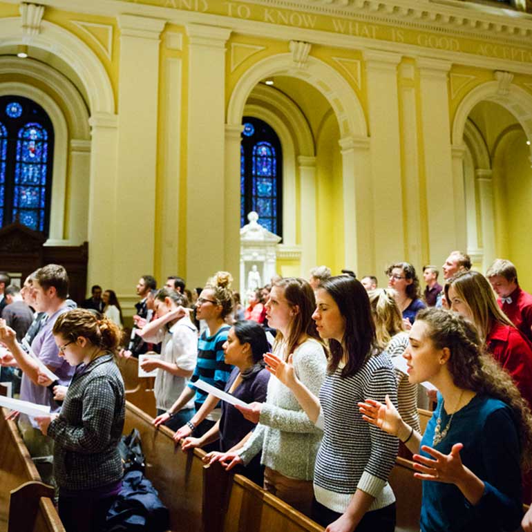 Students sing at worship